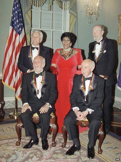 Pete Seeger, back right, with singer Aretha Franklin, actor Kirk Douglas, composer Morton Gould and director Harold Prince, following a 1994 dinner at the State Department in Washington.