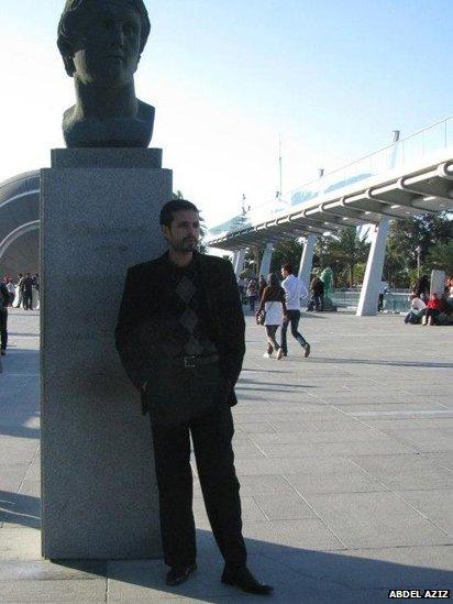 Abdel Aziz, Alexandria, Egypt stands under a statue of Alexander the Great.