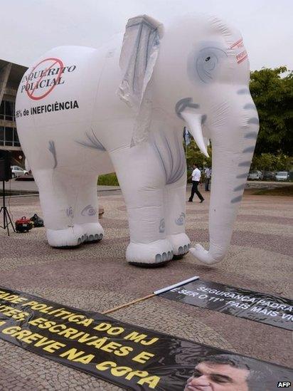 A dummy white elephant during a police protest in Rio de Janeiro, on May 7, 2014.