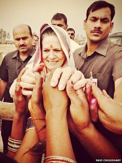 Congress president Sonia Gandhi greets supporters before her departure from a public meeting in Amethi.