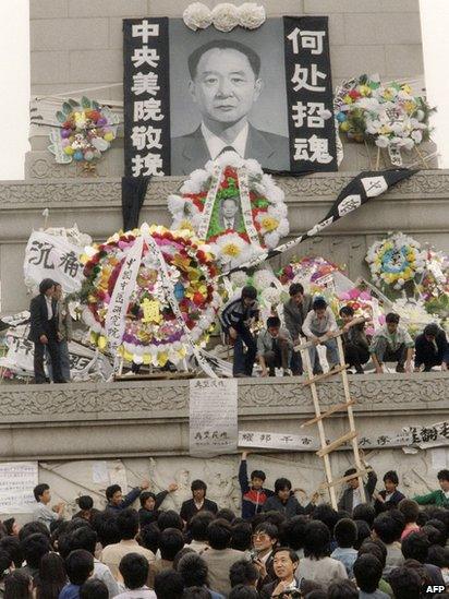 Students put wreaths in front of a portrait of former Chinese Communist Party leader and liberal reformer Hu Yaobang on 19 April 1989