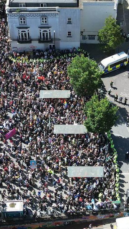 An aerial view of a group of people at a protest.