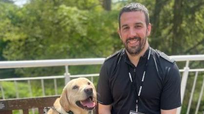 Man smiling with his dog