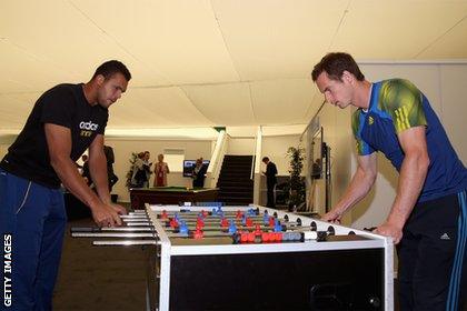 Andy Murray (right) enjoys a game of table football with Jo-Wilfried Tsonga