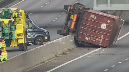 A lorry on its side on the A14 by Bar Hill, Cambridgeshire