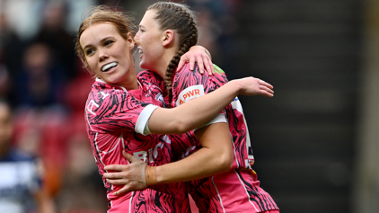 Emma Sing of Gloucester-Hartpury celebrates with teammate Mia Venner earlier this season