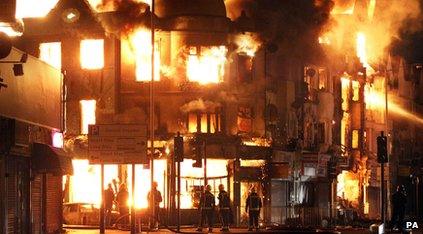 Reeves furniture shop on fire during the riots.