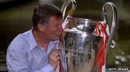 Sir Alex Ferguson kissing the Champions League trophy