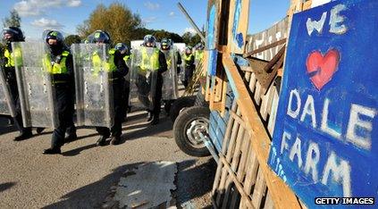 Riot police next to We Love Dale Farm sign