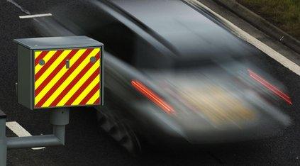 Car speeds past a speed camera