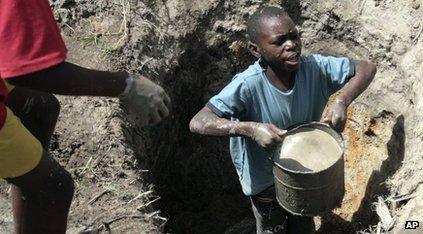 Boy looking for clean water in Zimbabwe