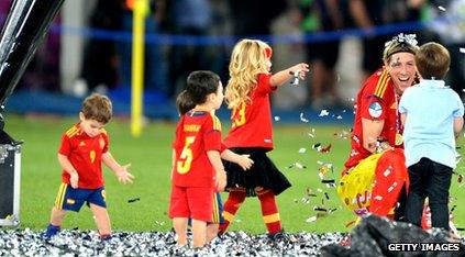 Torres chatting with children wearing Spain football kit