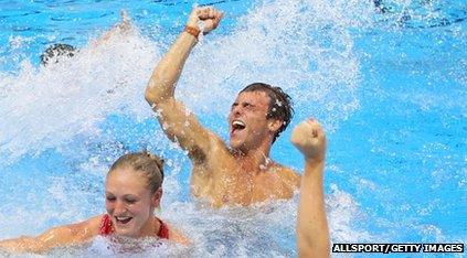 Tom Daley celebrates in the pool