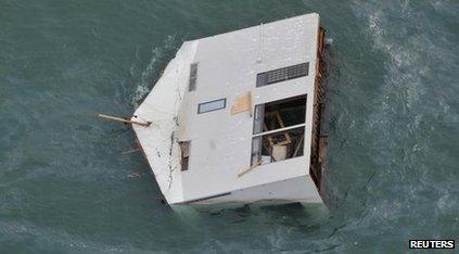 House drifting in ocean after Japan's earthquake and tsunami in March 2011