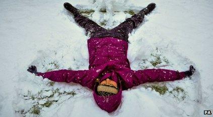 Woman doing snow angel