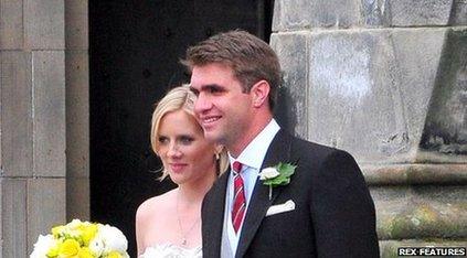 Oliver Baker seen with his wife on their wedding day