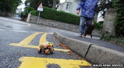 A toy car in the parking space