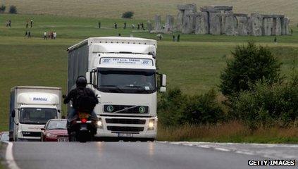 Trucks going past Stonehenge