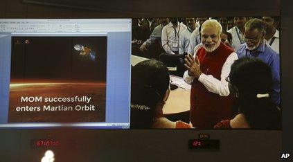 Indian PM celebrates putting a spaceship into orbit around Mars in September 2014