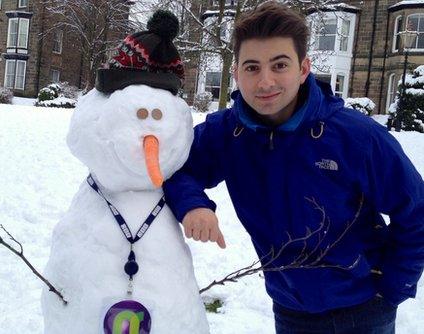 Ricky with his finished snowman.