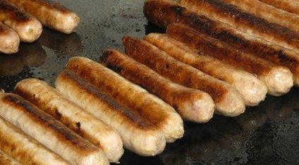 Sausages on a hot plate