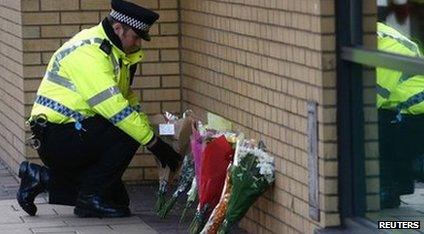 Flowers laid near the scene of the helicopter crash