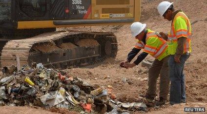 Workers excavate the video games