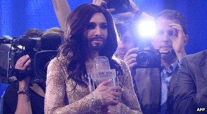 Conchita Wurst holding the Eurovision trophy