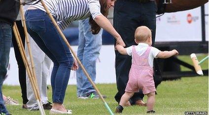The Duchess of Cambridge holding Prince George's hand as walks