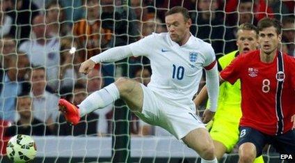 England striker Wayne Rooney (left)