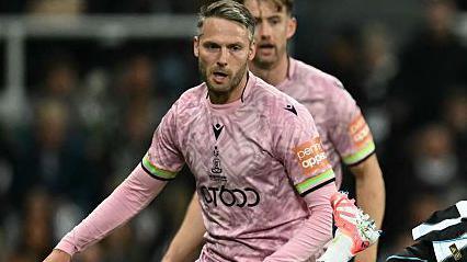 Bradford City midfielder Nick Powell in action, wearing the club's pink away strip.