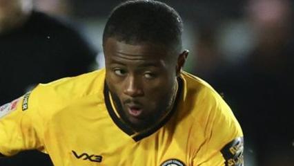 David Ajiboye keeps his eye on the ball as he shoots for goal