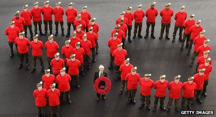 Soldiers mark out the figure of 90