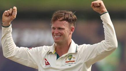 Matthew Kuhnemann of Australia celebrates taking a wicket