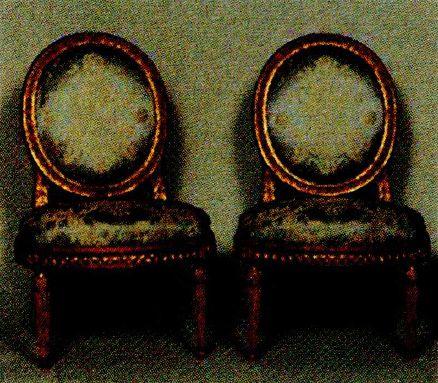 Grainy picture of two upholstered 18th-Century style chairs that were falsely sold as items that once belonged to Madame du Barry.