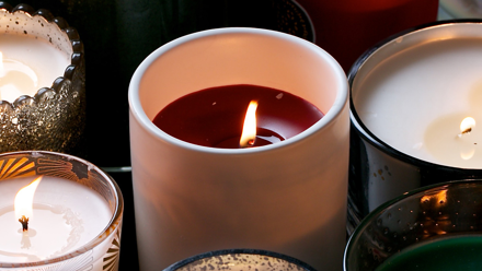 A generic shot of some fragrance-style candles, with flames