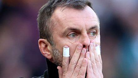 Charlton boss Nathan Jones with his hands over his face