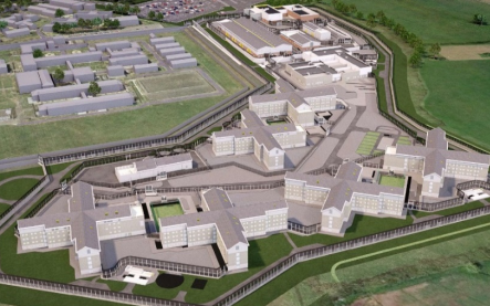 A design image of six house blocks in the shape of an "X" surrounded by a perimeter fence and fields. There are other buildings in the background.