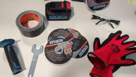 A picture of the tools found on the protesters en route to the airport: a pair of red gloves, silver gaffer tape and plastic safety glasses are among the items laid out on on a white table.