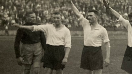 A group of Derby County players performing a Nazi salute on a football pitch in Germany in 1934