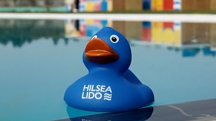Hilsea Lido branded bath duck floating on the pool