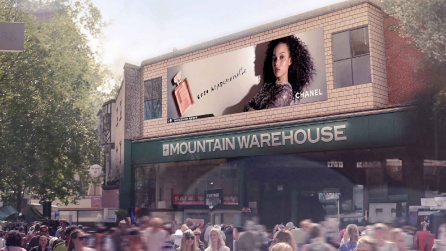 In the background of a busy street screen we see a model in an advert on a giant screen above the Mountain Warehouse shop in Norwich.