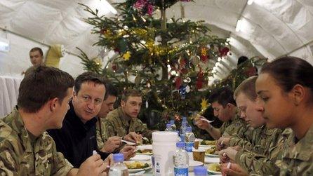 David Cameron eats dinner with British troops.