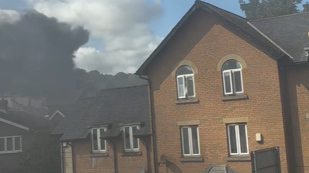 Thick black smoke is seen rising above homes in Scarborough