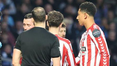 Jobe Bellingham (right) after being shown a red card for Sunderland