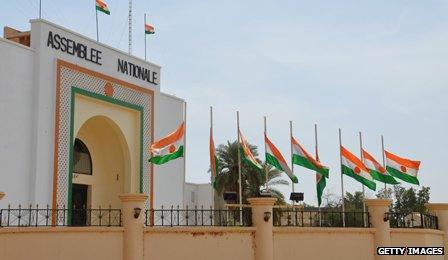 Flags flying at half-mast in honour of migrants who died in a desert crossing