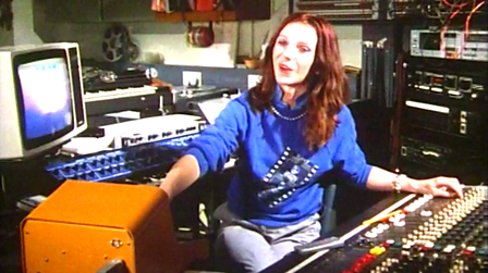 Elizabeth Parker surrounded by machines in the Radiophonic Workshop.