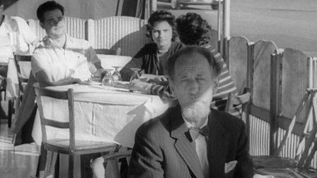 tv Tonight presenter Fyfe Robertson, sitting at a restaurant table in Havana.