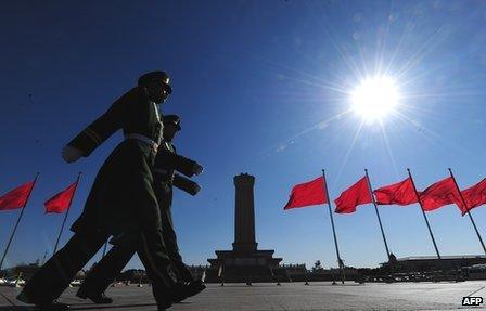 Paramilitary police march past the Monument to the People's Heroes on Tiananmen Square, Beijing