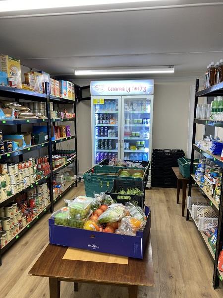 pantry with food stacked on shelves